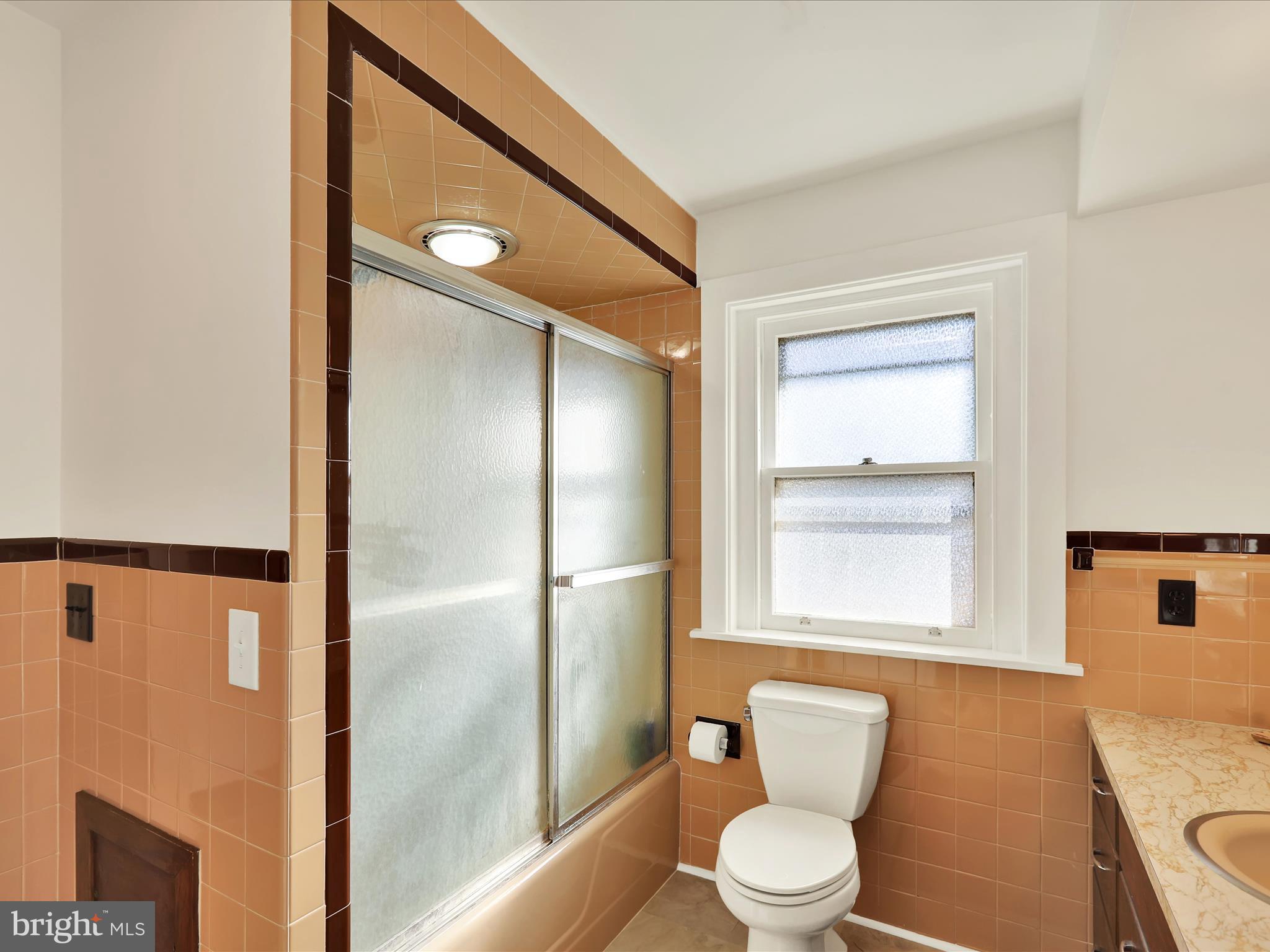 46 West Main Street Lebanon, PA 17042 - Photo 23 of 33 a bathroom with a toilet a sink and a mirror