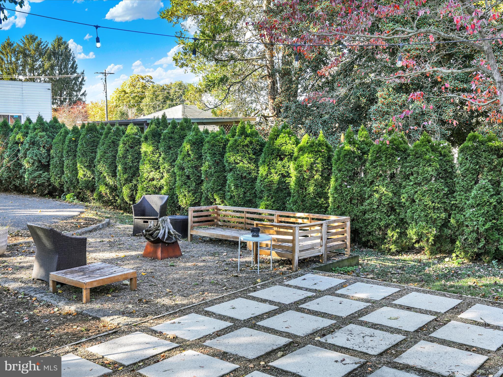 46 West Main Street Lebanon, PA 17042 - Photo 29 of 33 a backyard of a house with large trees and outdoor seating