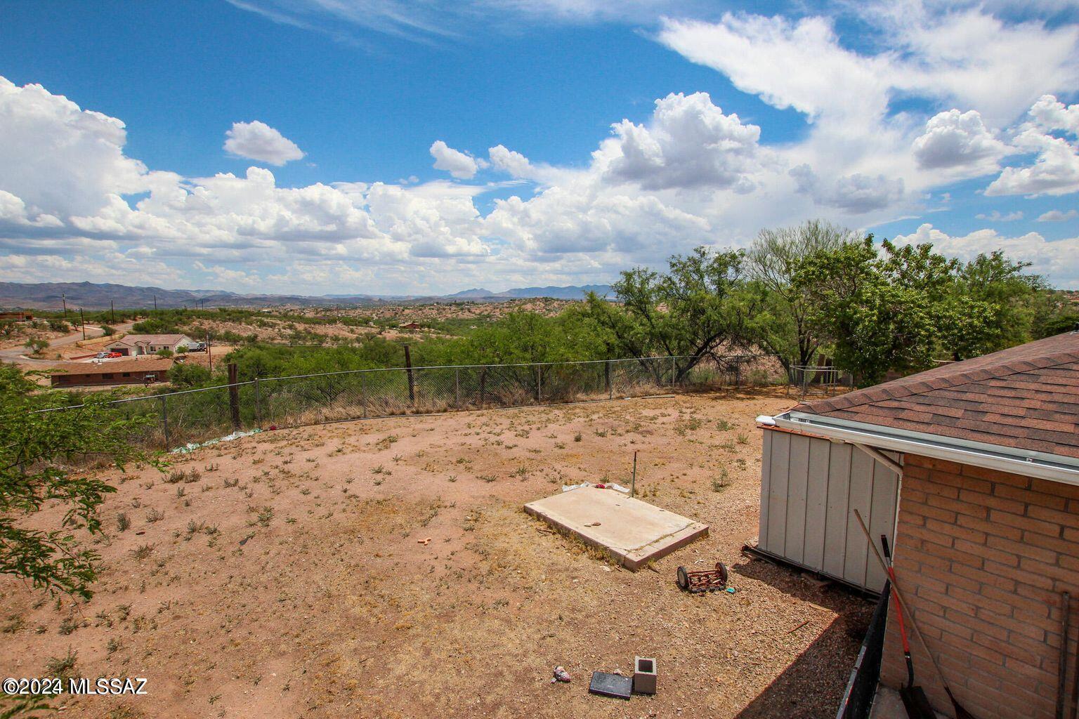 380 Paseo Ardilla Rio Rico, AZ 85648 - Photo 5 of 9 a backyard of a house with lots of green space
