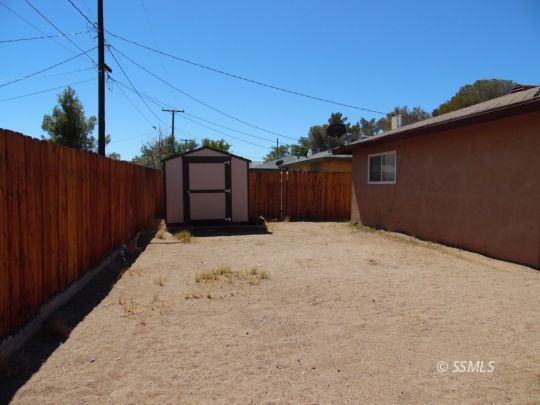 208 South Greenlawn Street Ridgecrest, CA 93555 - Photo 29 of 29 a view of a backyard of the house