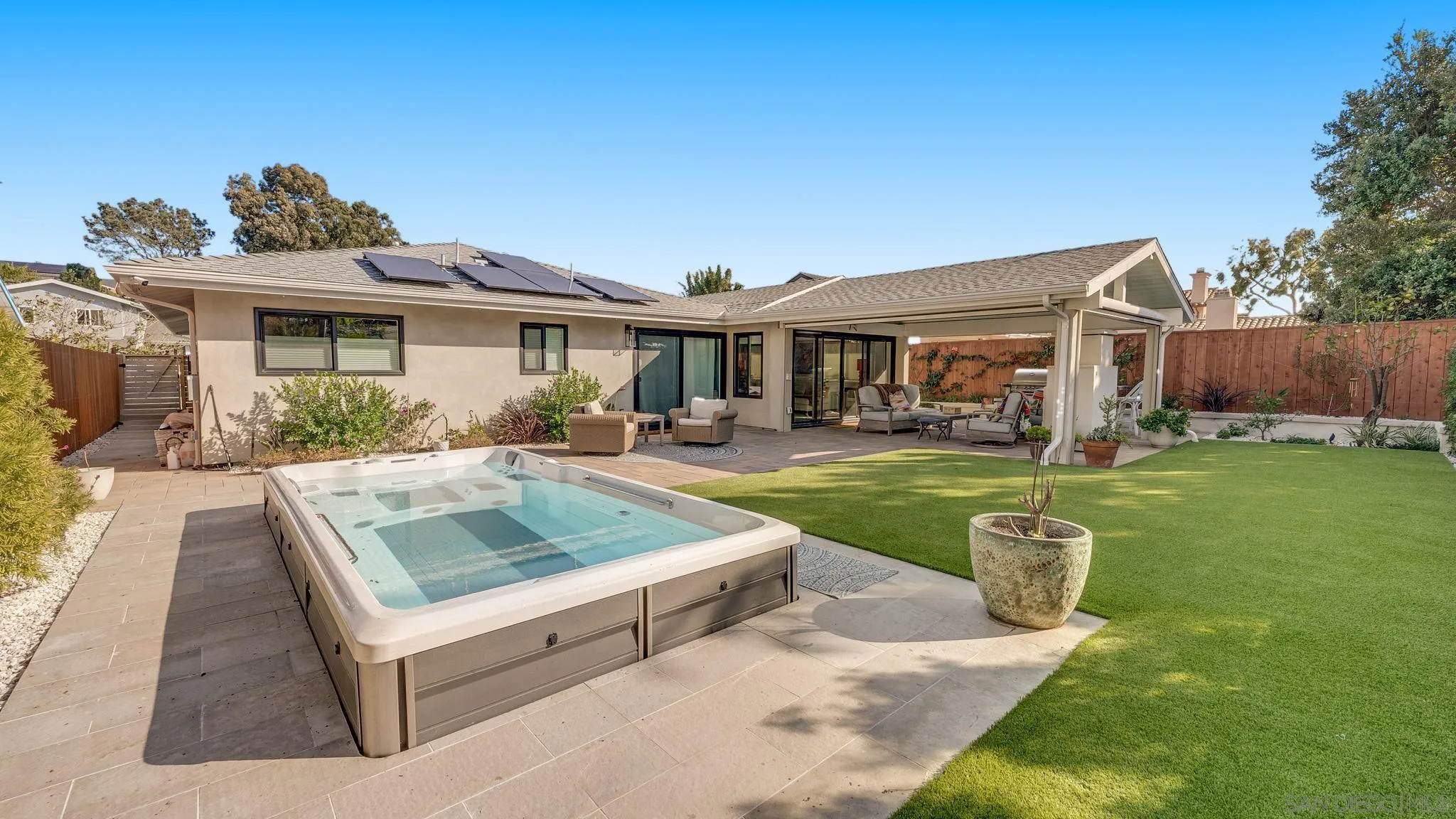 a view of a house with a yard porch and sitting area