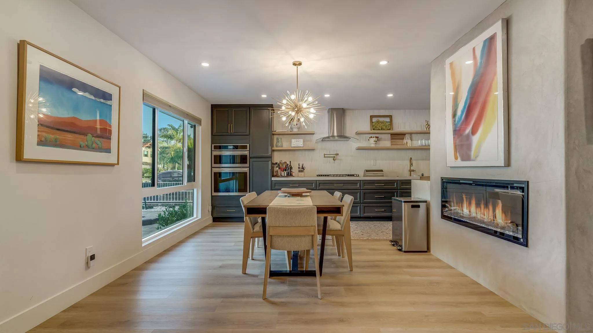 14146 Recuerdo Drive Del Mar, CA 92014 - Photo 13 of 54 a kitchen with a table chairs refrigerator and window
