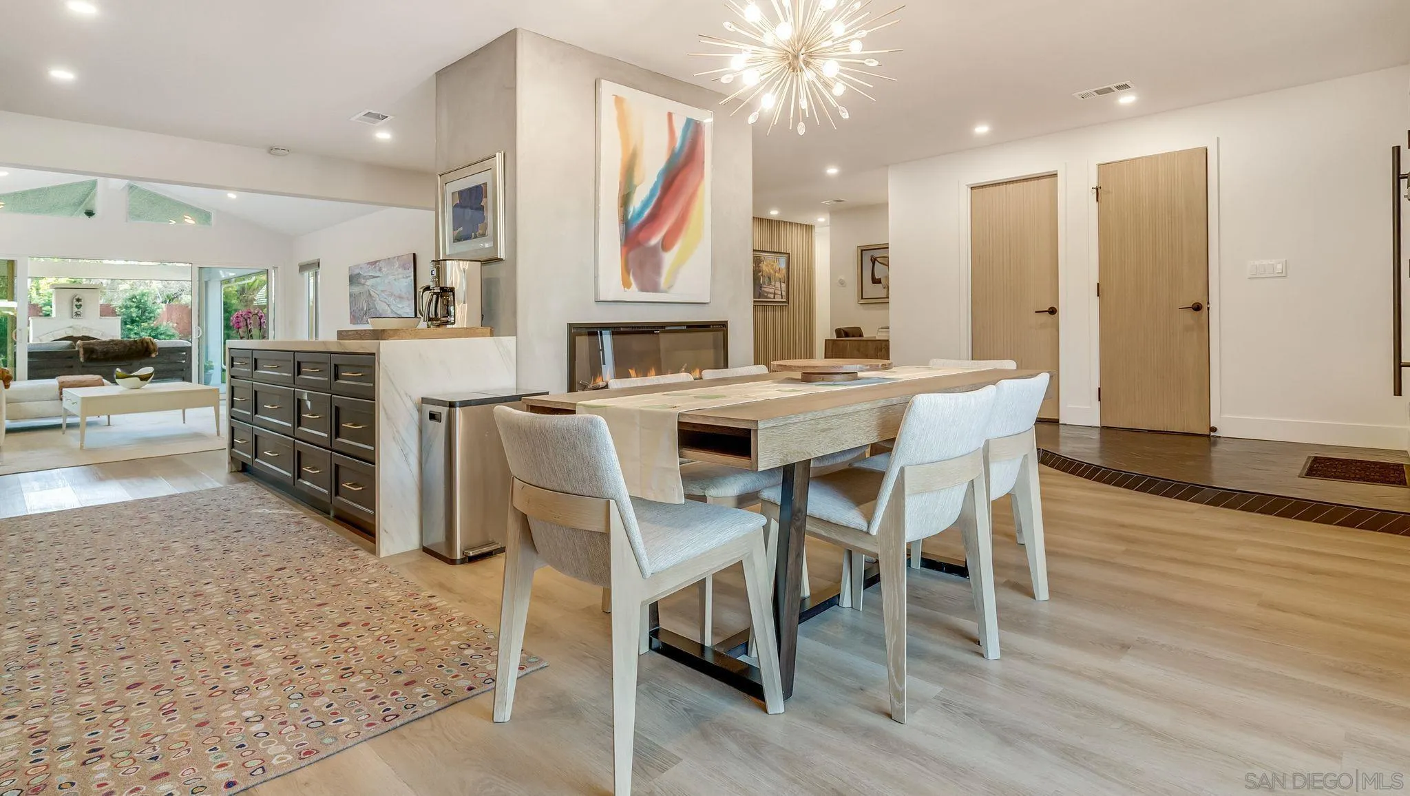 14146 Recuerdo Drive Del Mar, CA 92014 - Photo 15 of 54 a view of a dining room with furniture and wooden floor