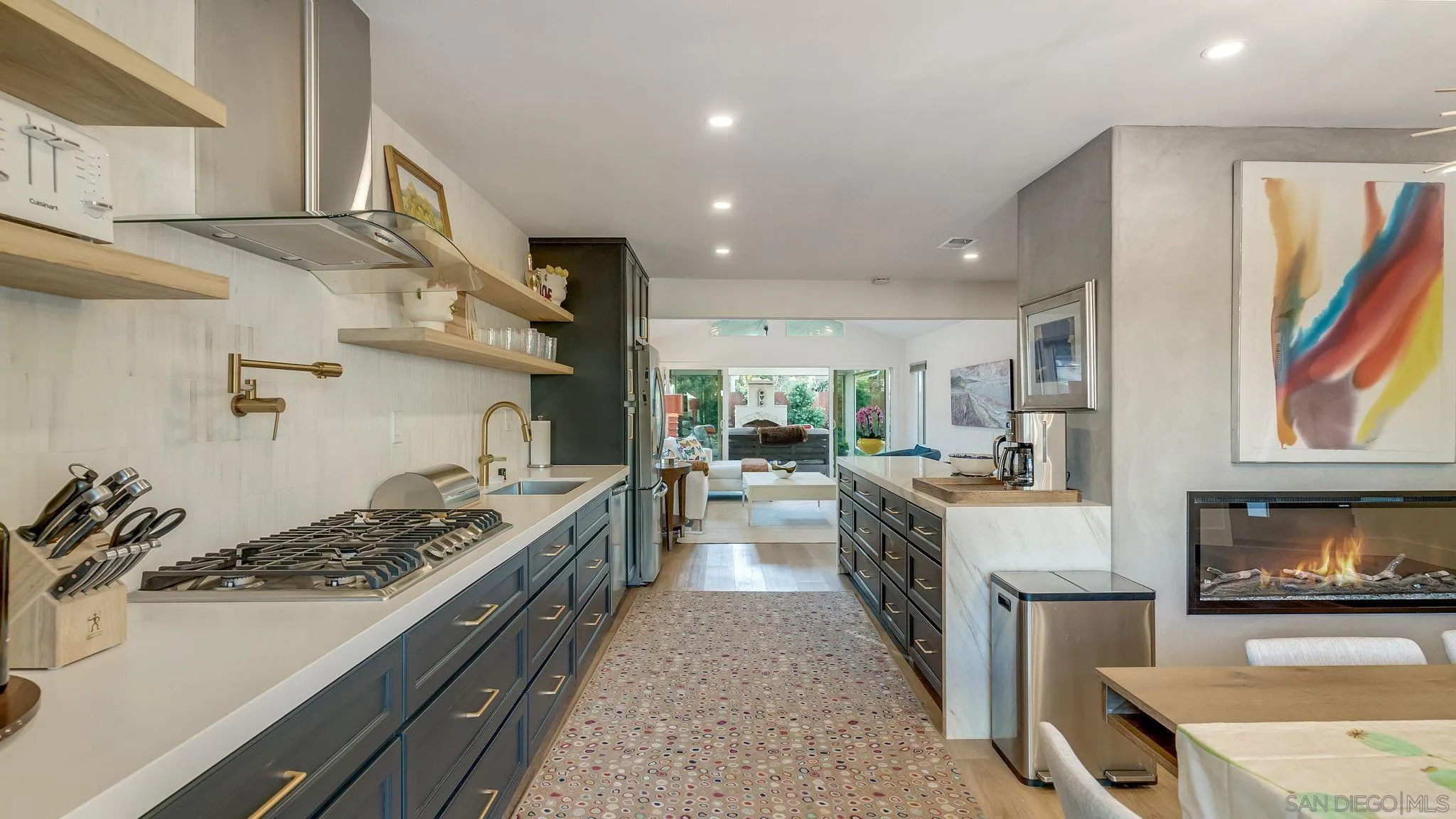 14146 Recuerdo Drive Del Mar, CA 92014 - Photo 16 of 54 a large kitchen with stainless steel appliances granite countertop a stove and a sink