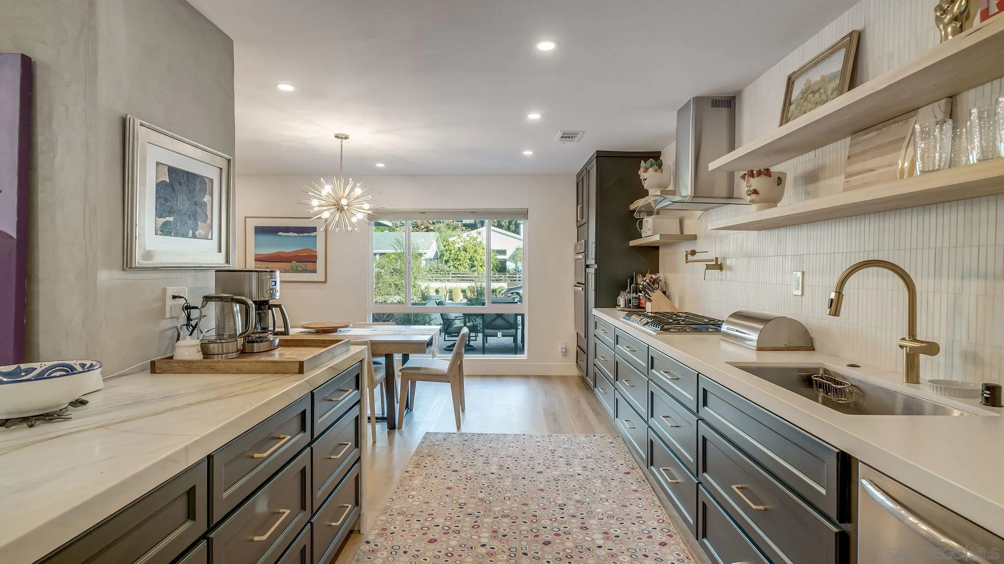 14146 Recuerdo Drive Del Mar, CA 92014 - Photo 17 of 54 a kitchen with sink stove and cabinets