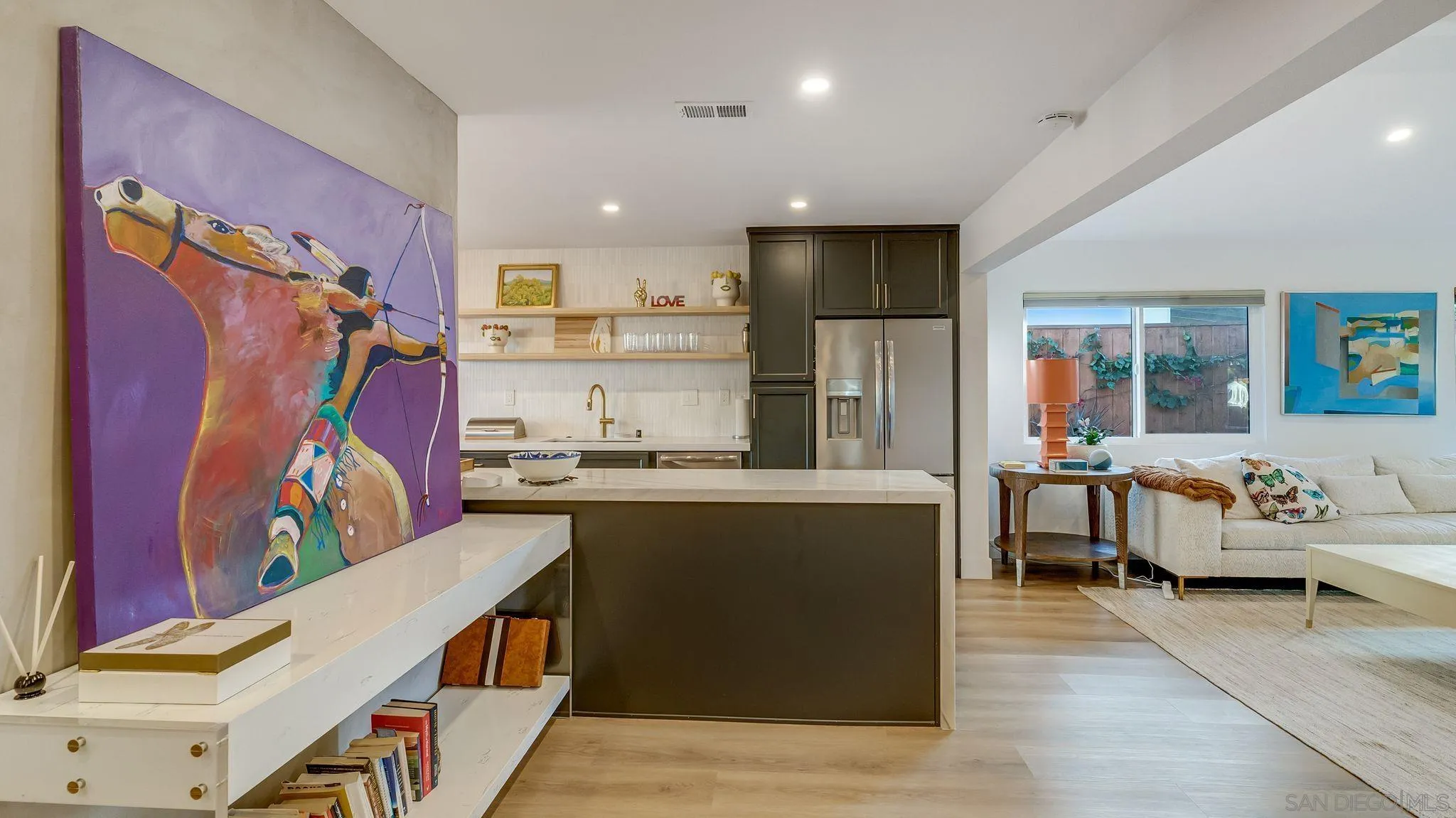 14146 Recuerdo Drive Del Mar, CA 92014 - Photo 18 of 54 a living room with stainless steel appliances kitchen island granite countertop furniture and a couch