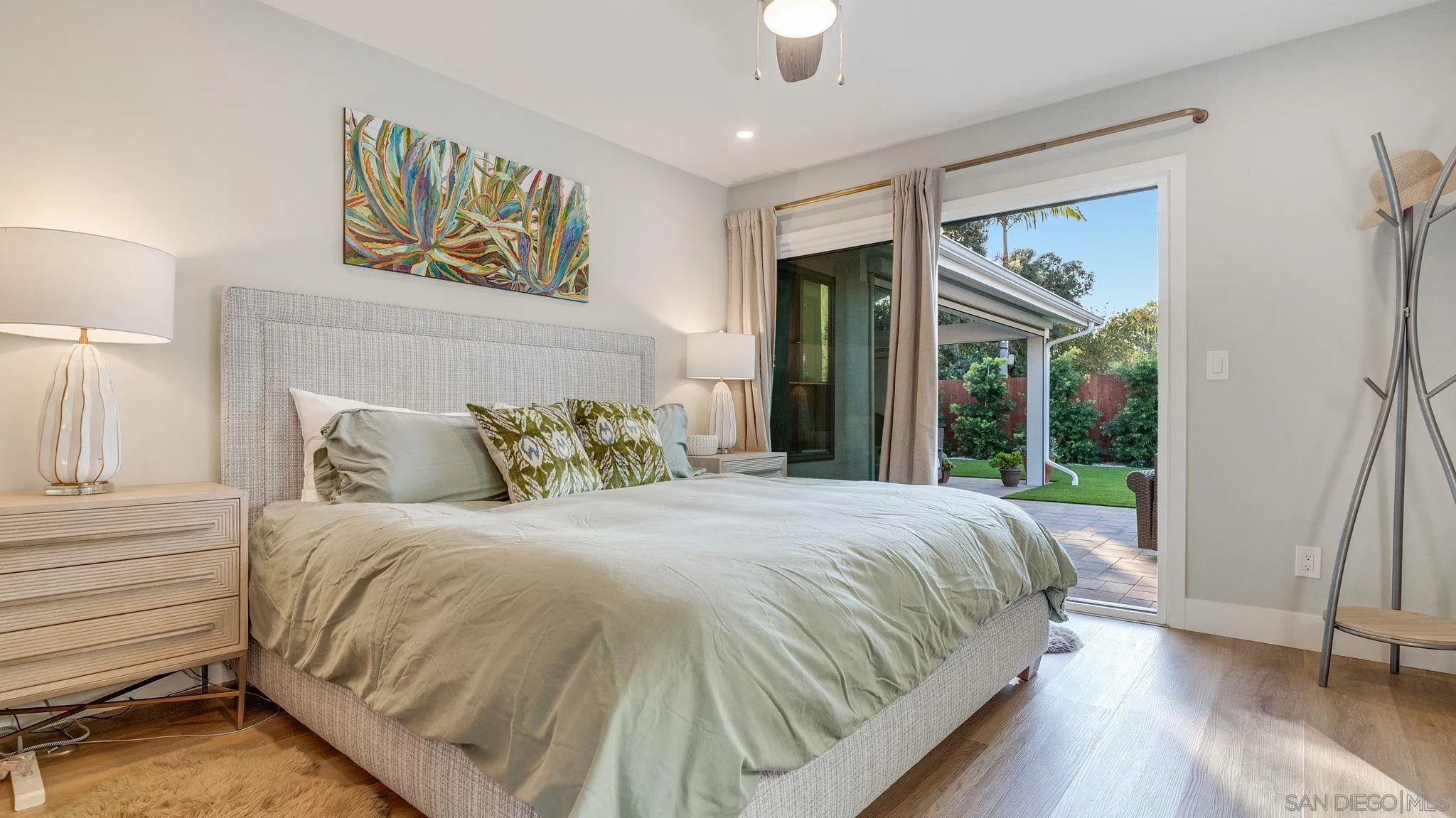 14146 Recuerdo Drive Del Mar, CA 92014 - Photo 22 of 54 a large bed sitting in a bedroom next to a window