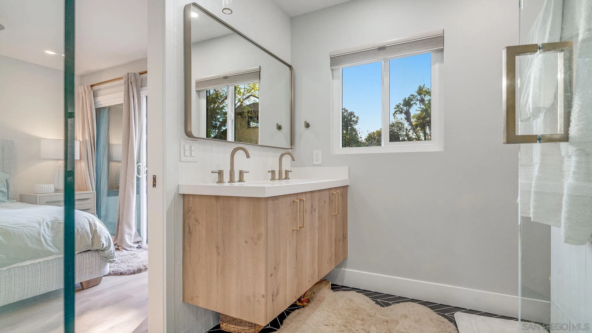 14146 Recuerdo Drive Del Mar, CA 92014 - Photo 25 of 54 a bathroom with a sink and a mirror