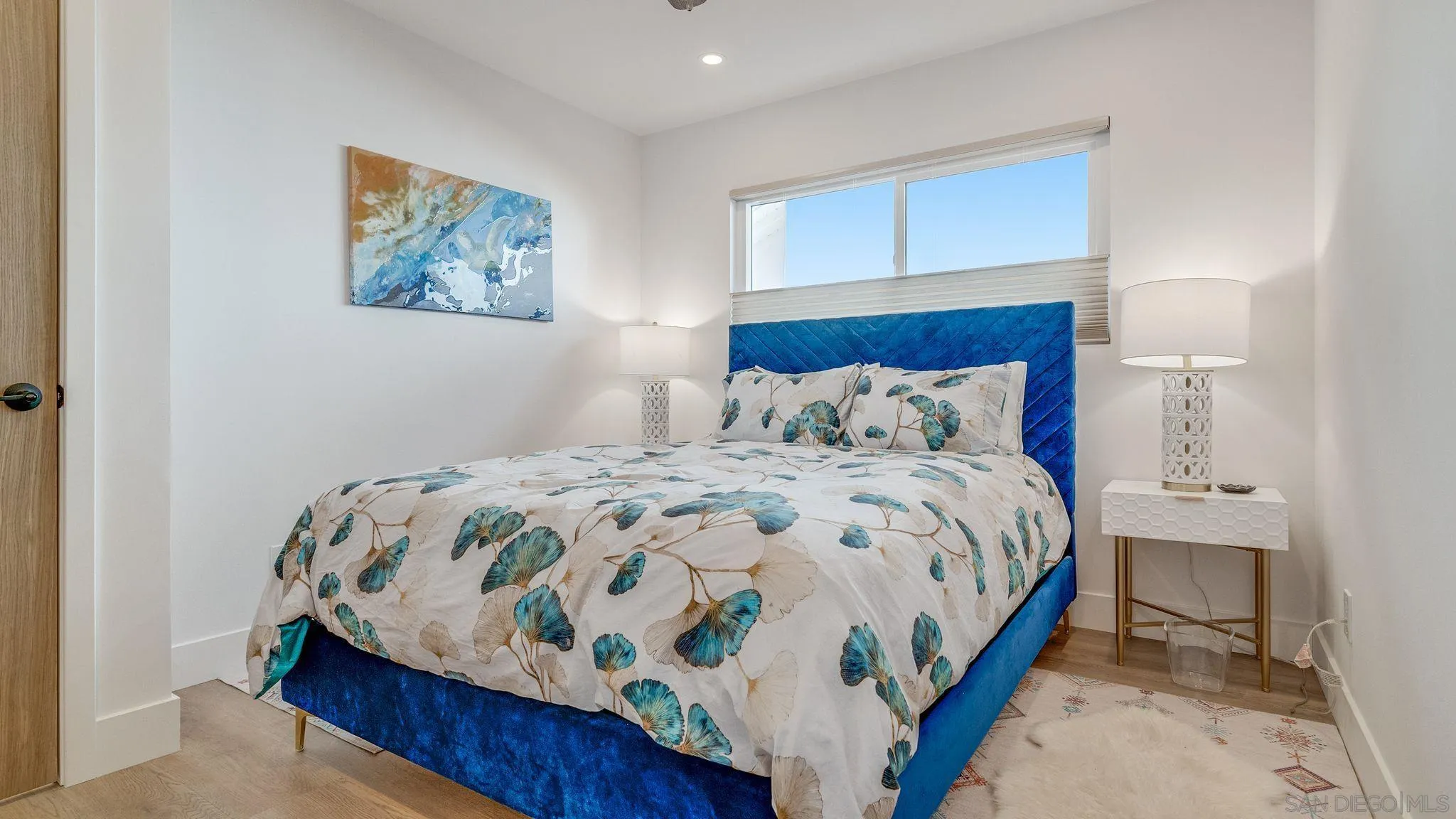 14146 Recuerdo Drive Del Mar, CA 92014 - Photo 26 of 54 a bedroom with a bed and painting on the wall