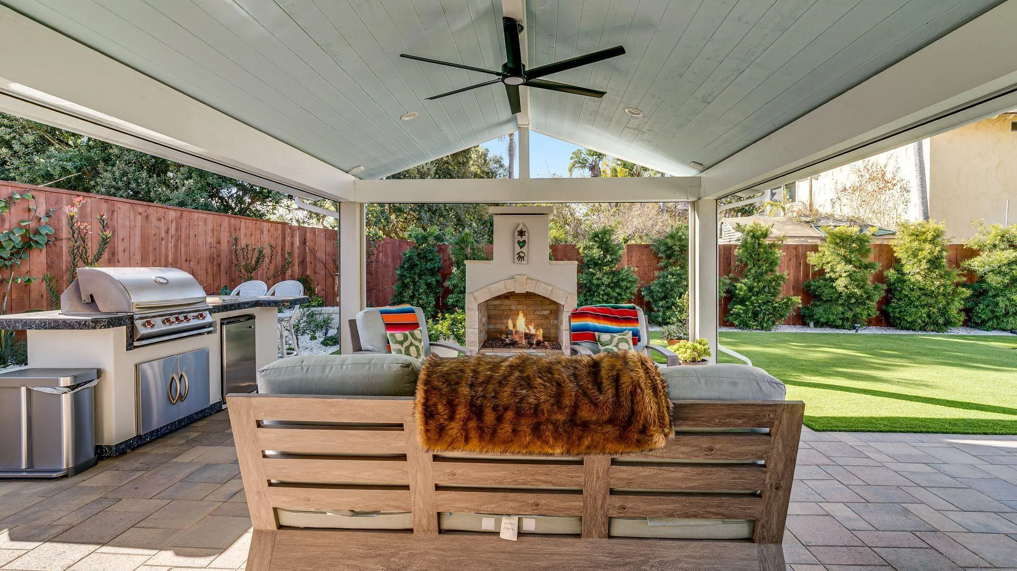 14146 Recuerdo Drive Del Mar, CA 92014 - Photo 35 of 54 a living room with fireplace furniture and a garden