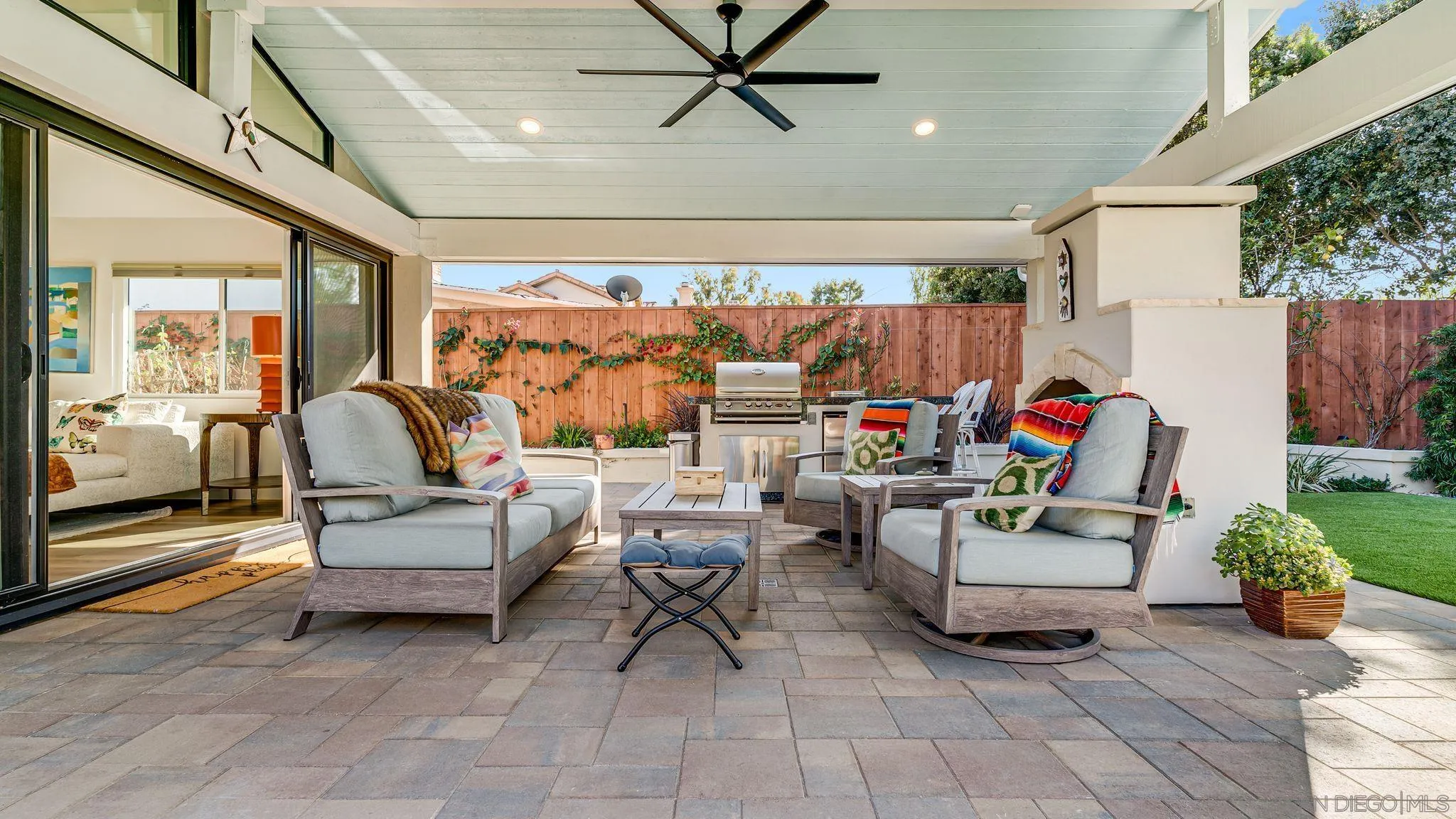 14146 Recuerdo Drive Del Mar, CA 92014 - Photo 36 of 54 a living room with patio furniture and a chandelier