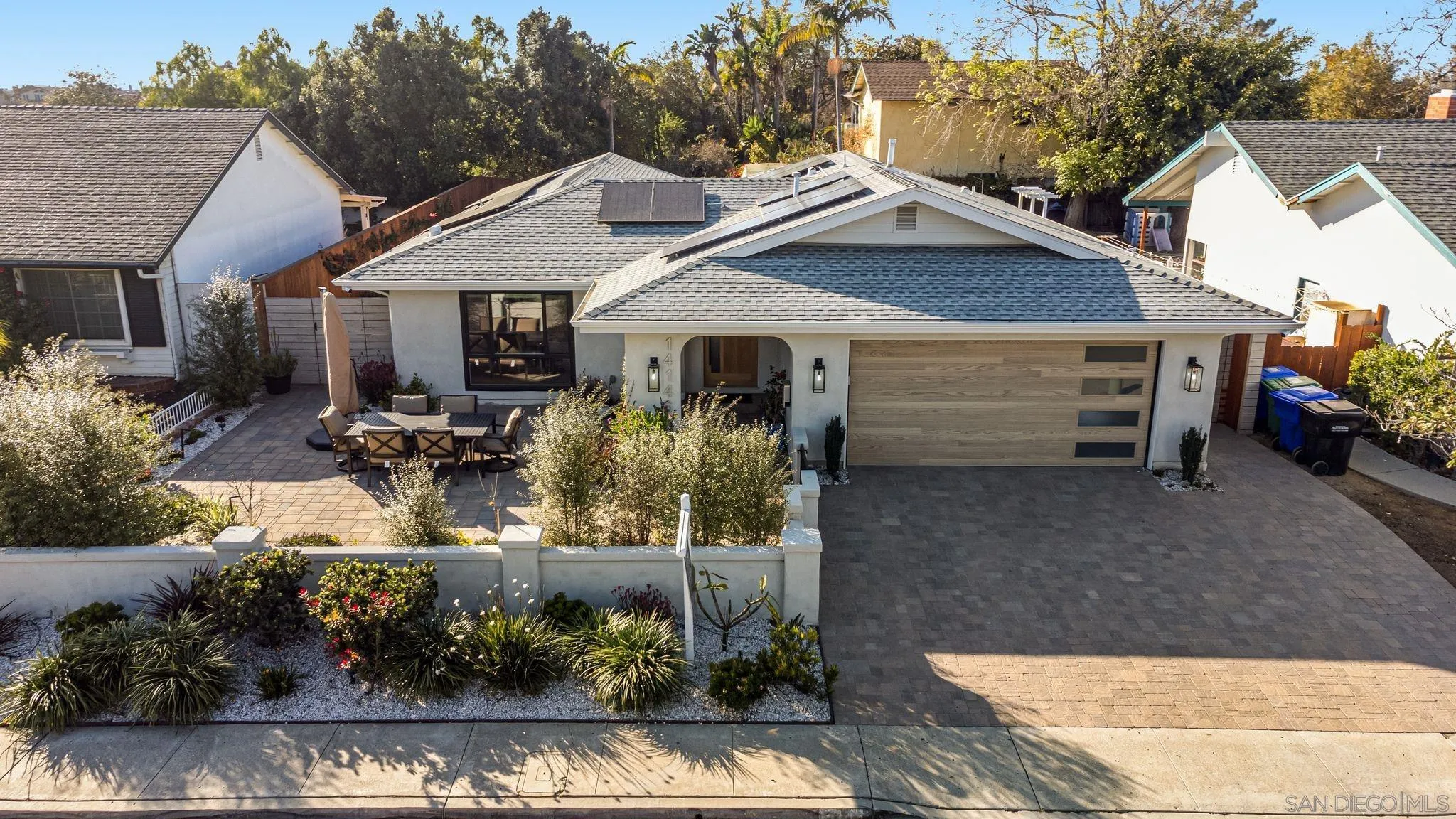 14146 Recuerdo Drive Del Mar, CA 92014 - Photo 5 of 54 a front view of a house with a yard and potted plants