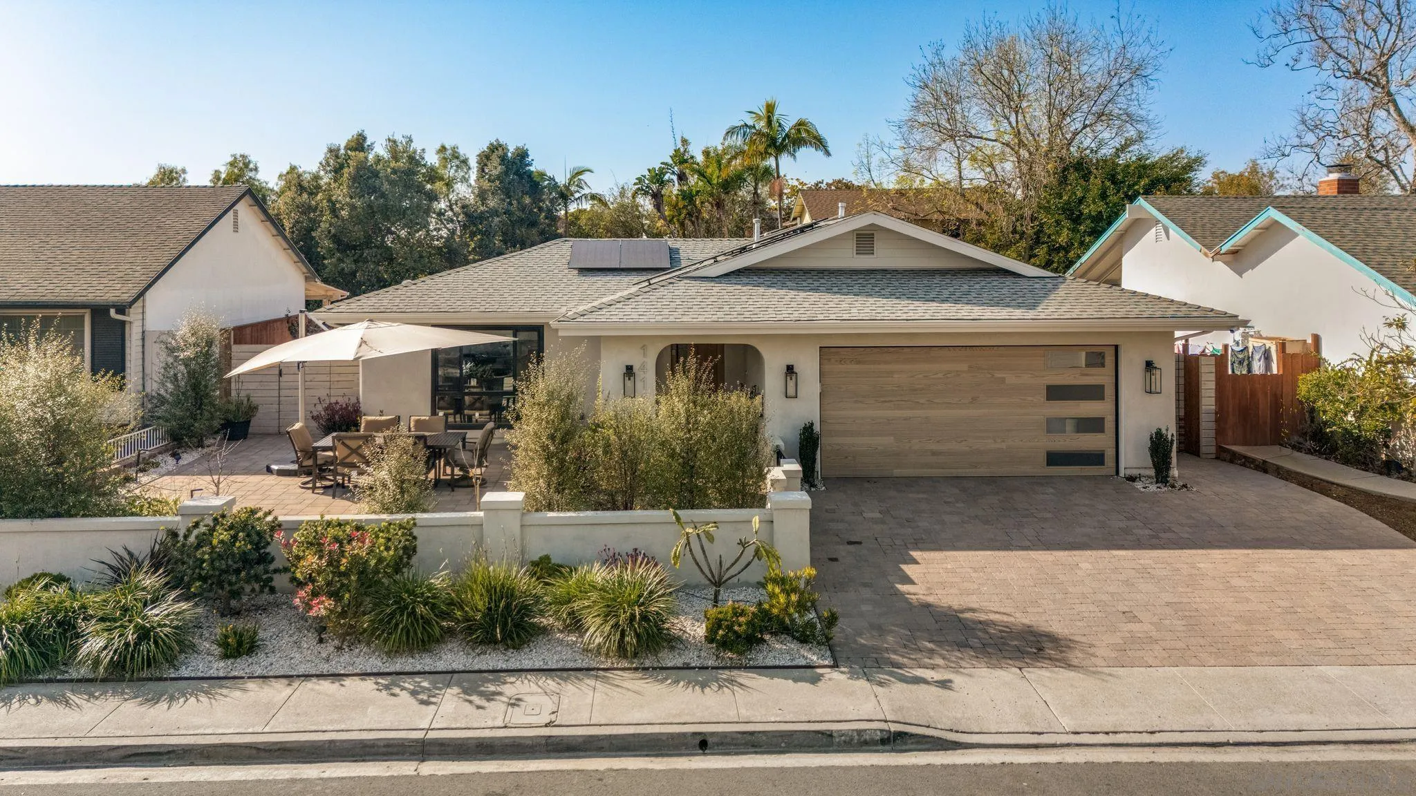 14146 Recuerdo Drive Del Mar, CA 92014 - Photo 52 of 54 a front view of a house with garden
