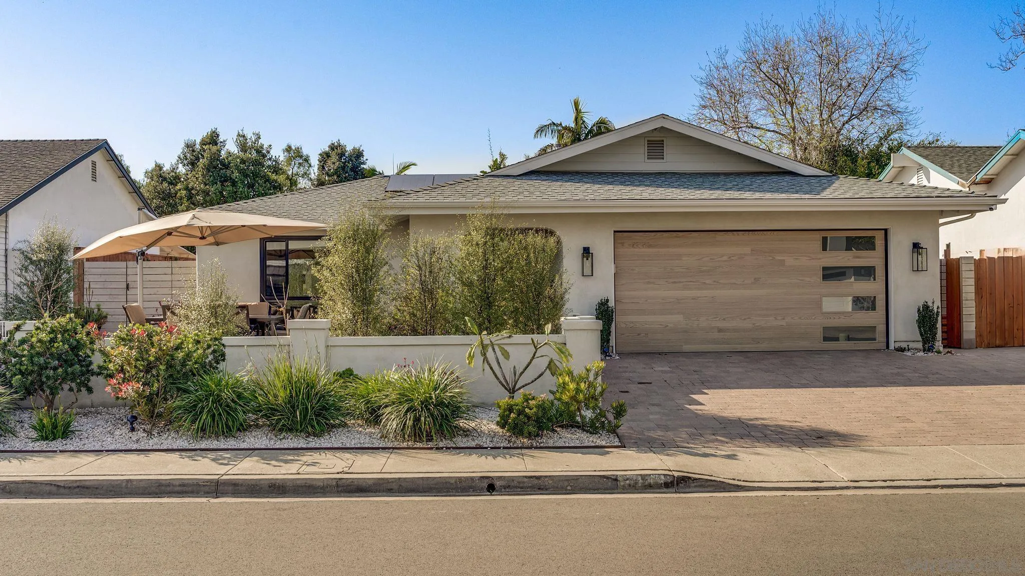 14146 Recuerdo Drive Del Mar, CA 92014 - Photo 54 of 54 a front view of a house with a yard and garage