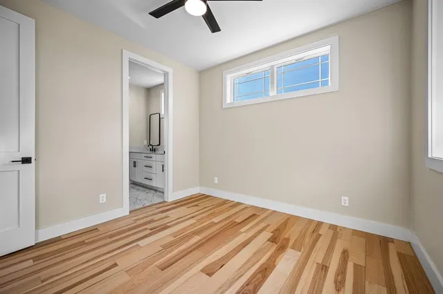a view of wooden floor and windows in a room
