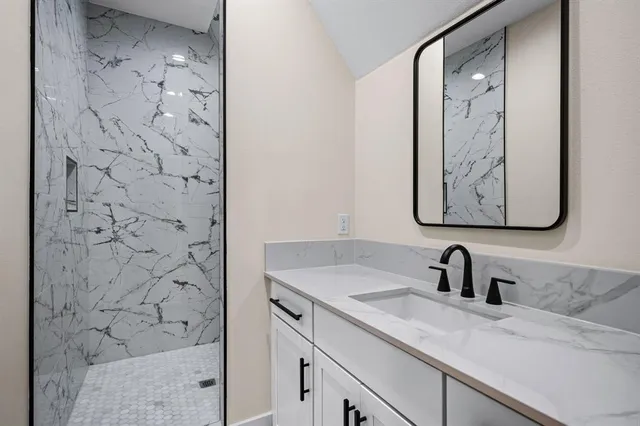 a bathroom with a sink and a mirror