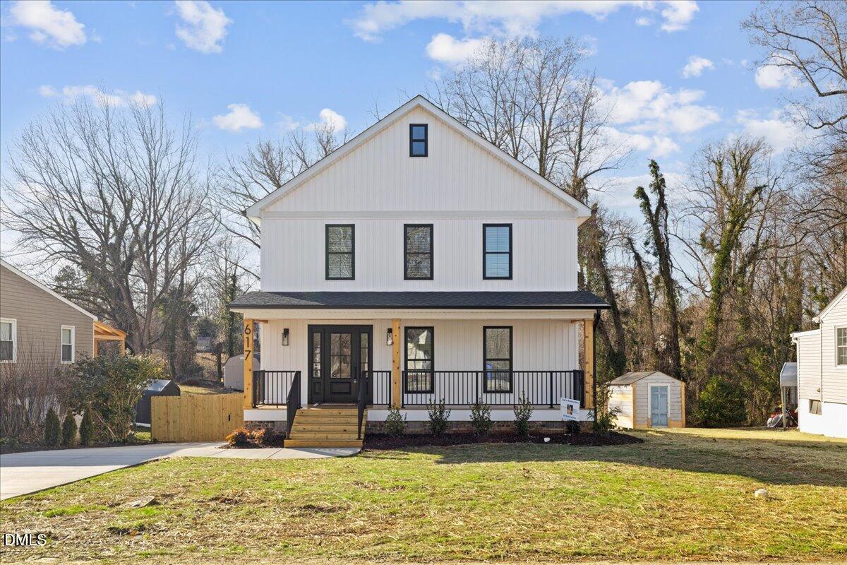 617 North 3rd Street Mebane, NC 27302 - Photo 2 of 50 a front view of a house with garden
