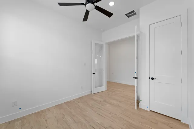 a view of a hallway with a hardwood floor