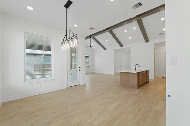 a view of a room with cabinet and windows