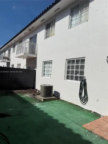 a backyard of house with garden