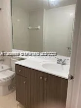 a bathroom with a sink and a toilet