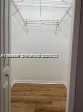 a view of a room with racks on the wall