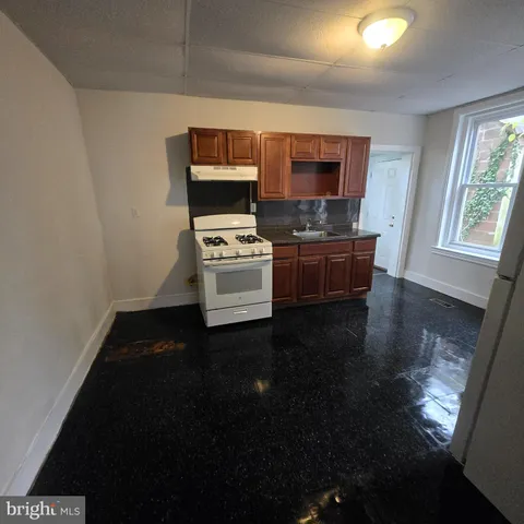 a living room with a couch and a flat screen tv