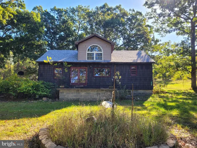 a view of house with yard