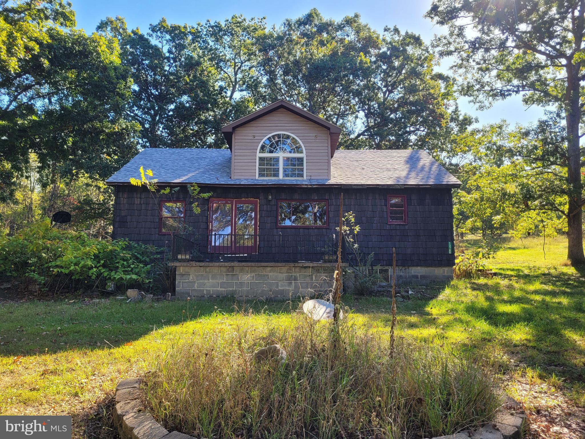 a view of house with yard