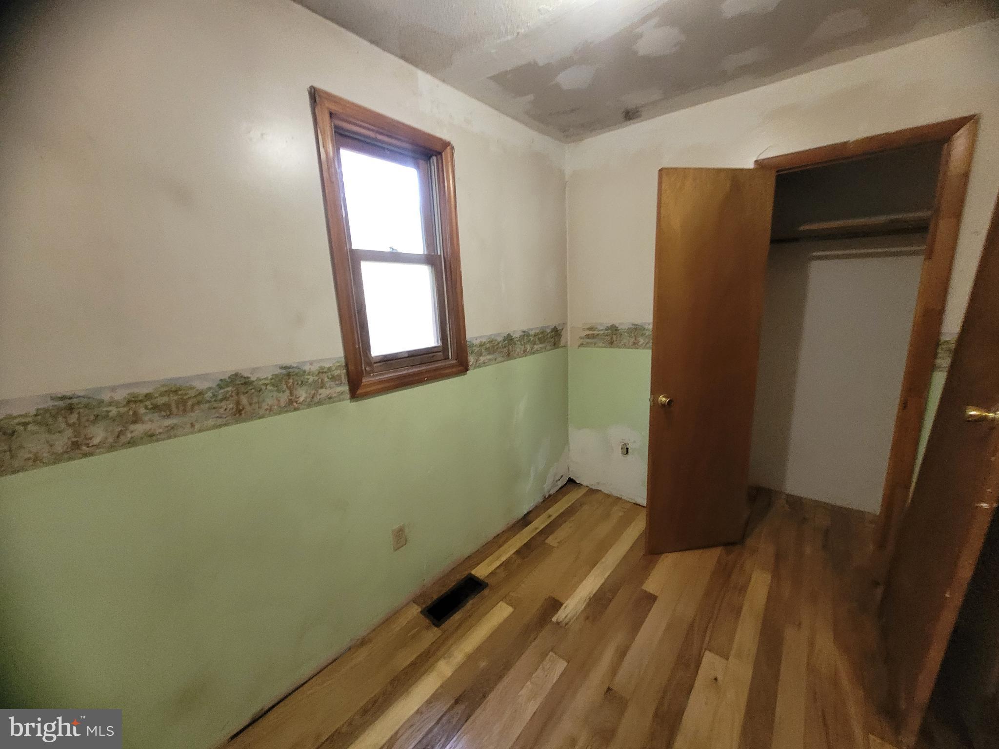 12700 Hockman Road Southeast Cumberland, MD 21502 - Photo 16 of 27 a view of a room with wooden floor and cabinet