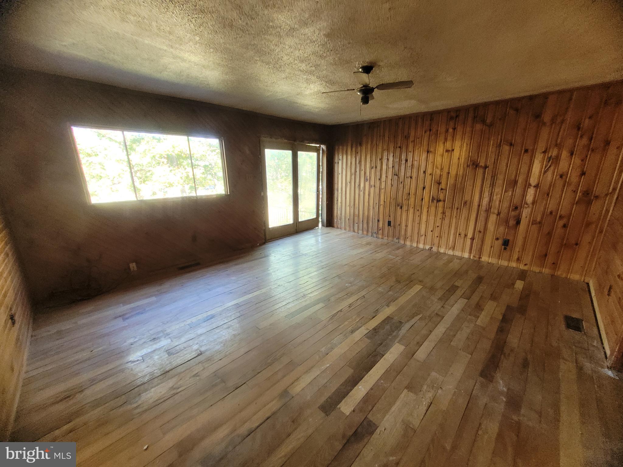 12700 Hockman Road Southeast Cumberland, MD 21502 - Photo 8 of 27 wooden floor in an empty room with a window