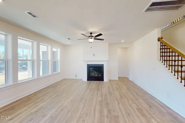 a view of kitchen with furniture and wooden floor