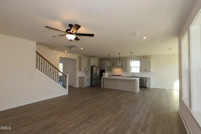 a view of kitchen with sink microwave and stove