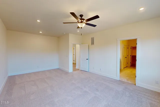 a view of room with a ceiling fan and window