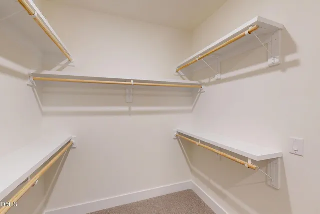 a bathroom with a double vanity sink a mirror and shower