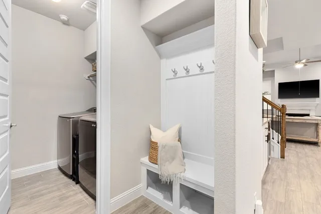 a view of kitchen with furniture and refrigerator