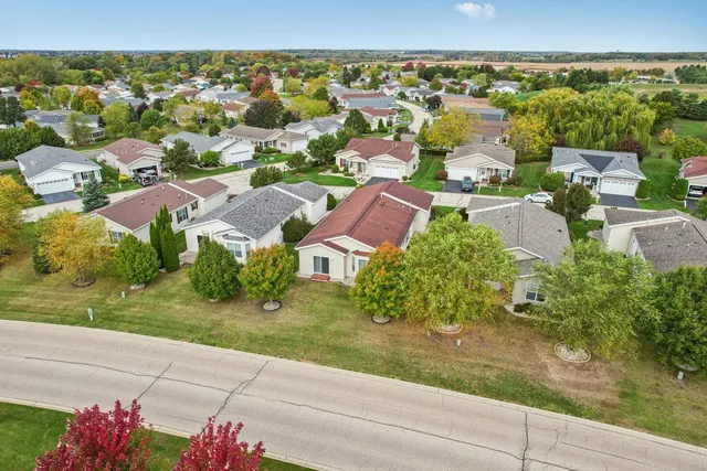 a house with green field in front of it