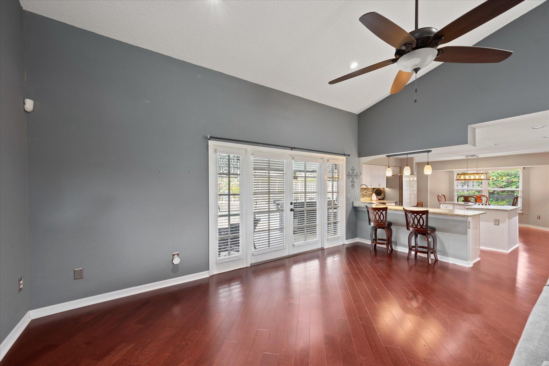 1373 Brampton Cove Wellington, FL 33414 - Photo 8 of 35 a view of a work space with wooden floor and furniture