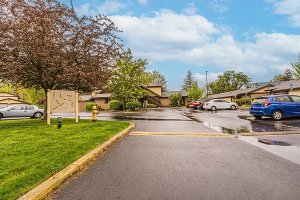 a view of a street with a cars park