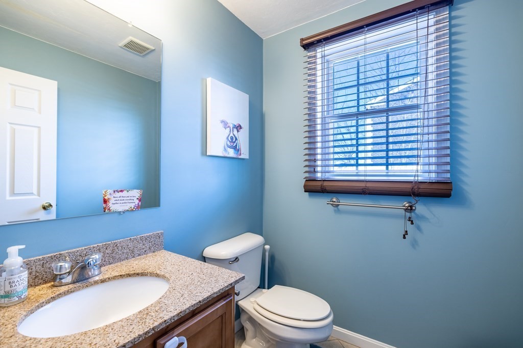 90 Central Street, Unit 2 East Bridgewater, MA 02333 - Photo 12 of 26 a bathroom with a sink a toilet and a mirror