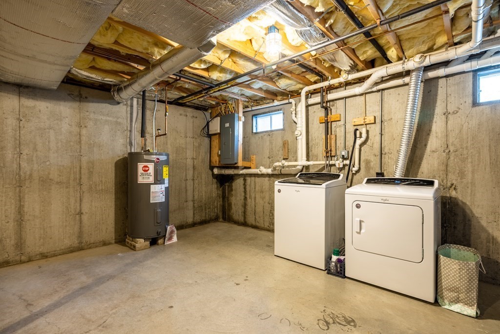 90 Central Street, Unit 2 East Bridgewater, MA 02333 - Photo 22 of 26 a view of storage and utility room with washer and dryer