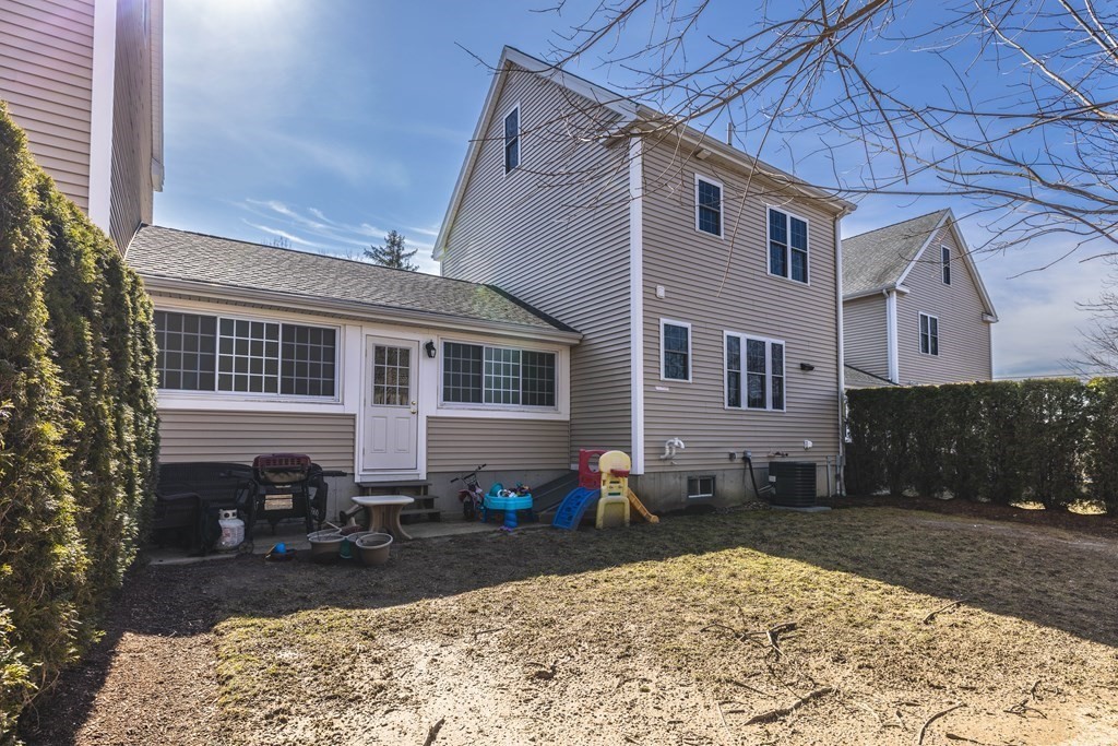 90 Central Street, Unit 2 East Bridgewater, MA 02333 - Photo 24 of 26 a view of a house with a patio