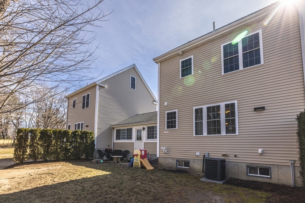 90 Central Street, Unit 2 East Bridgewater, MA 02333 - Photo 25 of 26 a view of a house with a yard