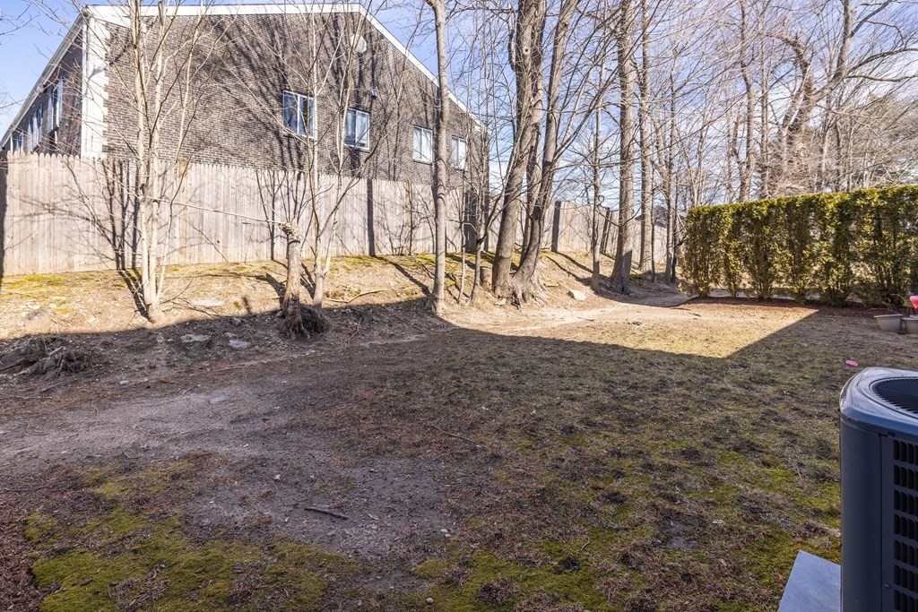 90 Central Street, Unit 2 East Bridgewater, MA 02333 - Photo 26 of 26 a view of yard covered with snow