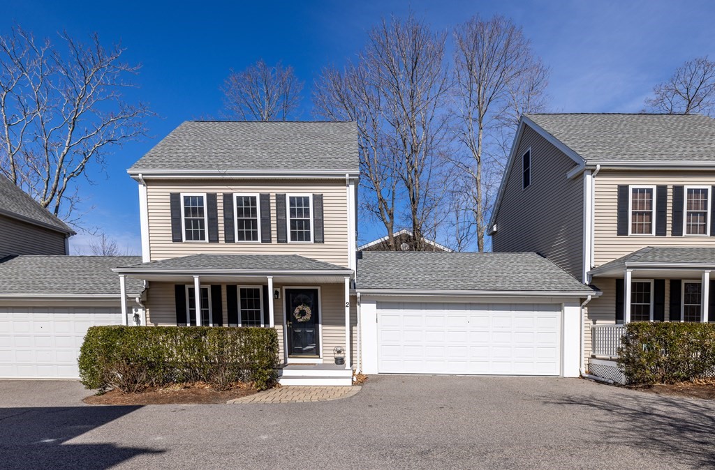 90 Central Street, Unit 2 East Bridgewater, MA 02333 - Photo 3 of 26 a front view of a house with a garden