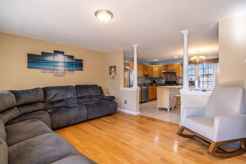 90 Central Street, Unit 2 East Bridgewater, MA 02333 - Photo 8 of 26 a living room with furniture and kitchen view