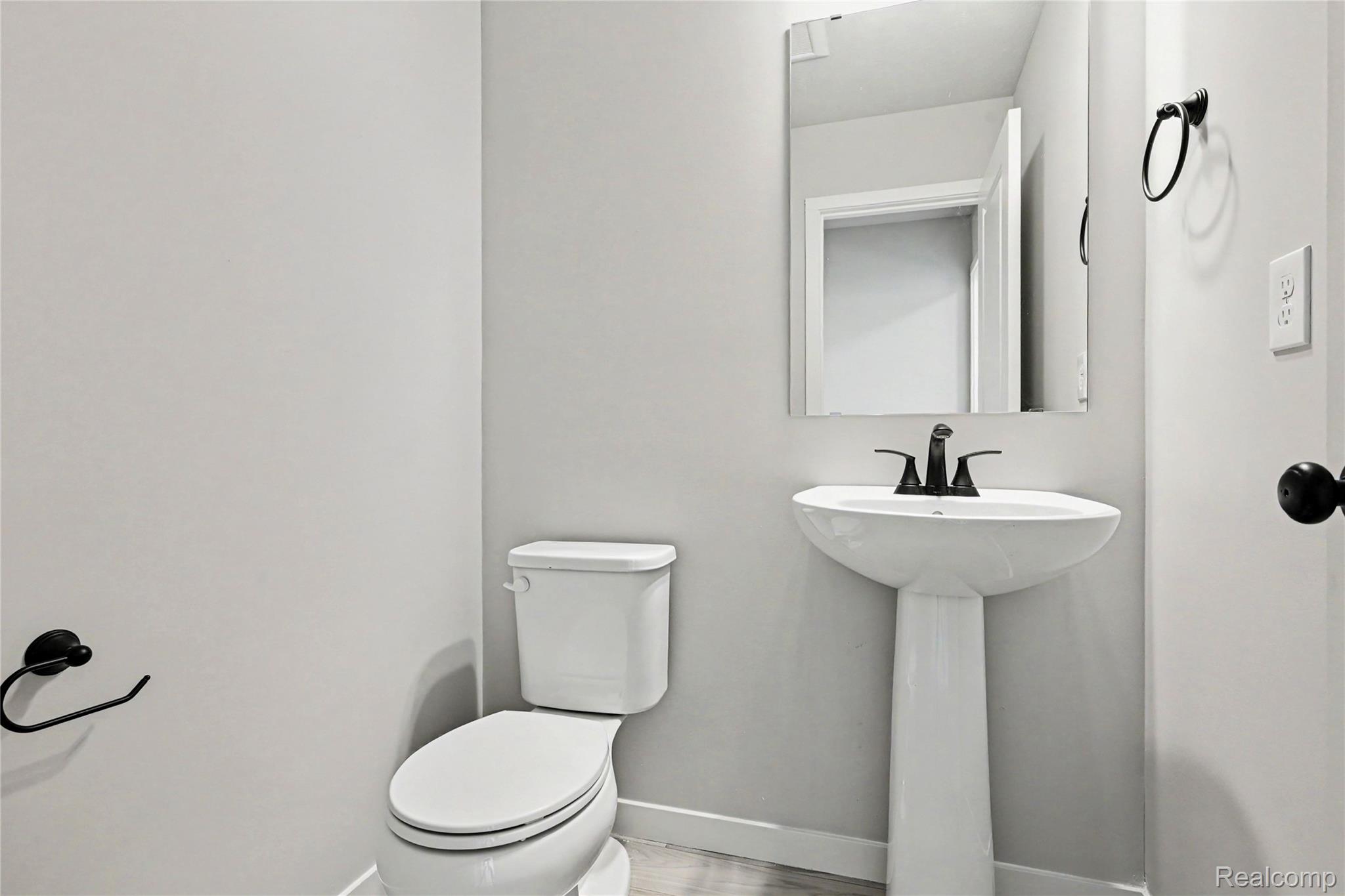 1230 Lockes Street Howell, MI 48843 - Photo 6 of 27 Stock Photo-Powder Room