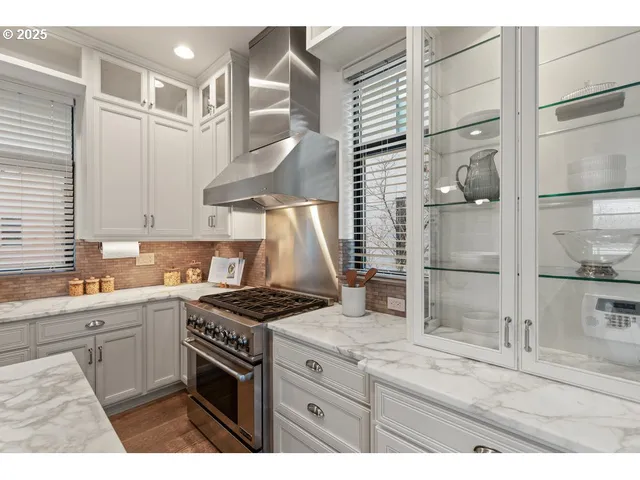 a kitchen with a stove and a refrigerator