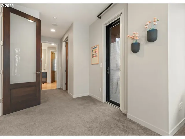 a view of a hallway with washer and dryer