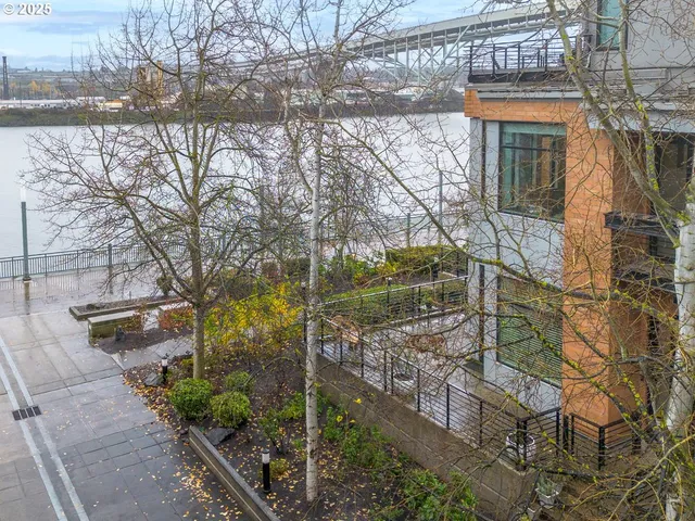 a view of a house with a tree